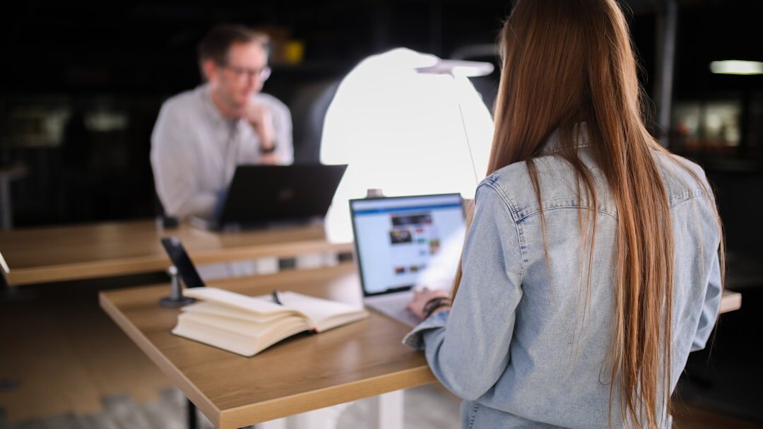 Journalist reviewing newspaper clippings at a desk