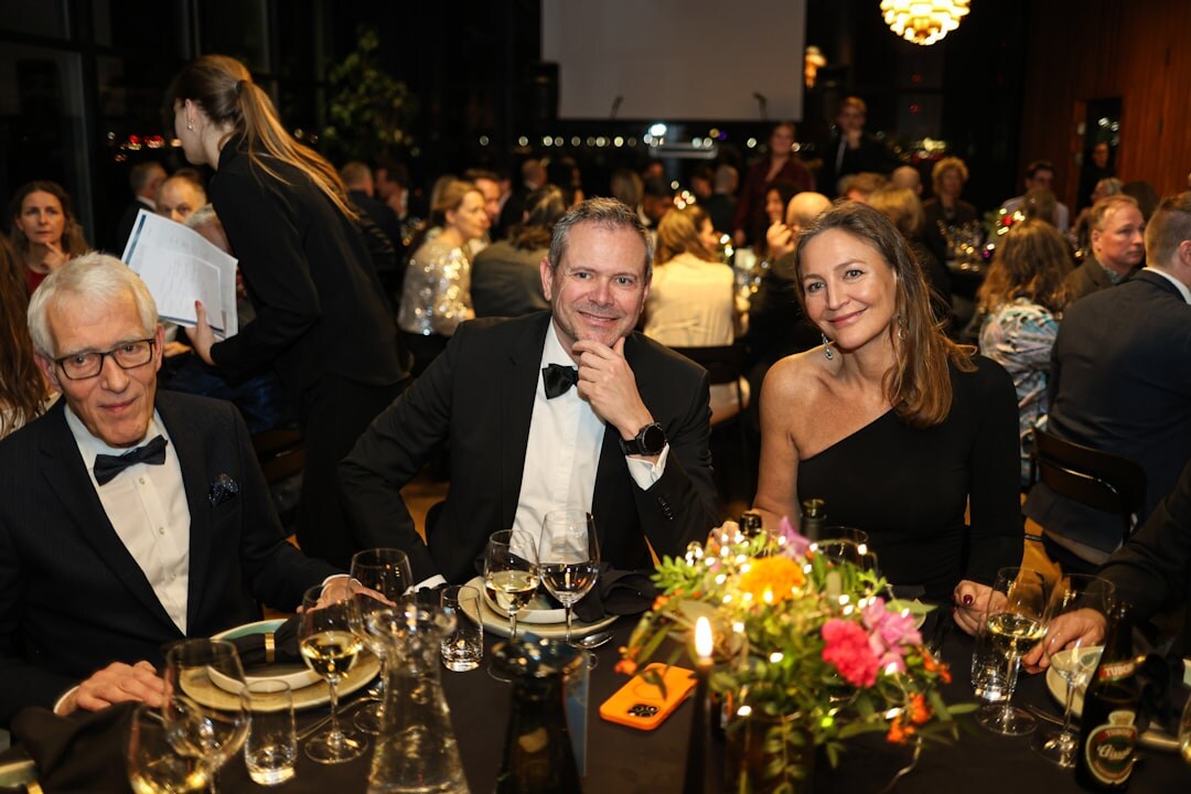 group of celebrities at dinner